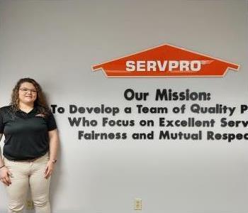 Head shot of female SERVPRO of Greensboro North employee with brown hair, wearing glasses, wearing a SERVPRO jacket.