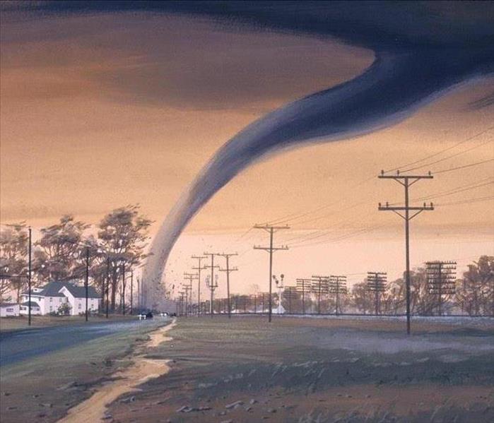 A tornado touches down in a field