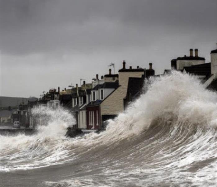 Storm surge send waves crashing into homes