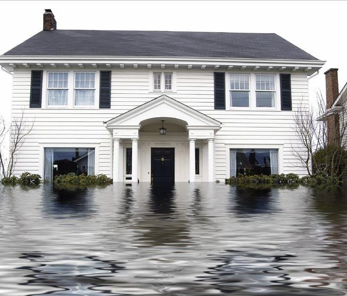 two story white house with water three feet up