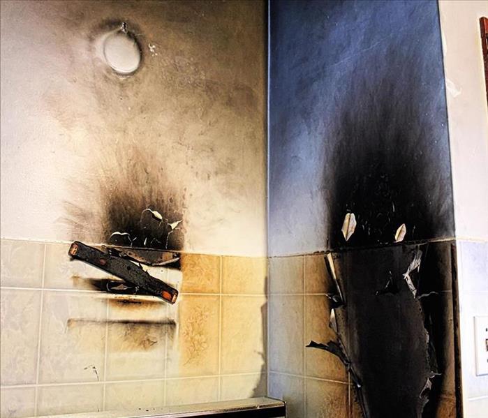 Damaged walls after grease fire. 