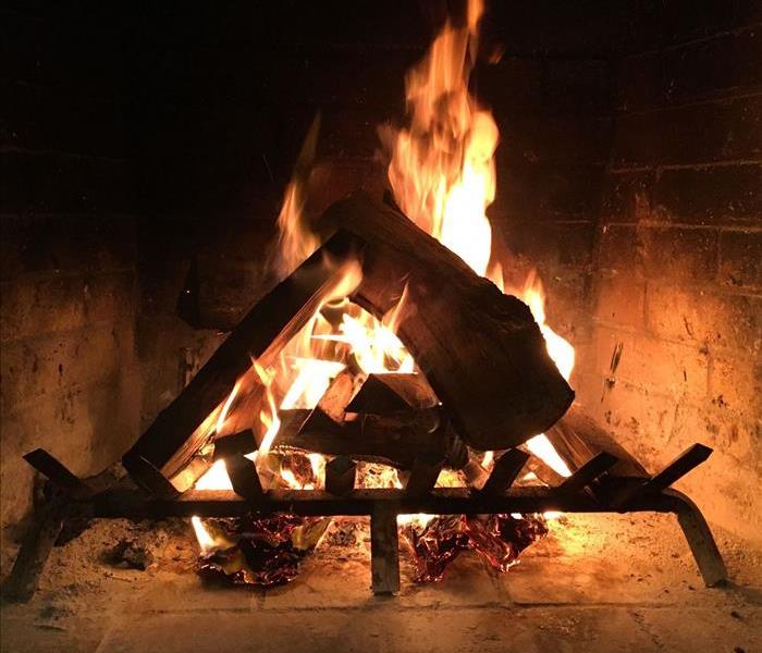 Wood burning fire inside a fireplace 